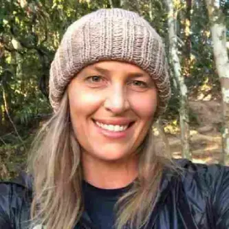 Woman smiling while sharing her testimonial